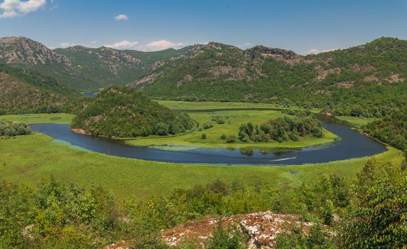 Panoramic view from above of Skadar lake and Crnojevica river in a national park, Montenegro, in a sunny summer day