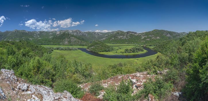 Panoramic view from above of Skadar lake and Crnojevica river in a national park, Montenegro, in a sunny summer day