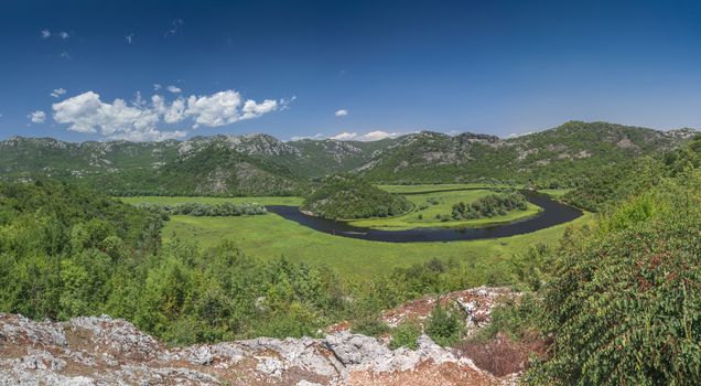 Panoramic view from above of Skadar lake and Crnojevica river in a national park, Montenegro, in a sunny summer day