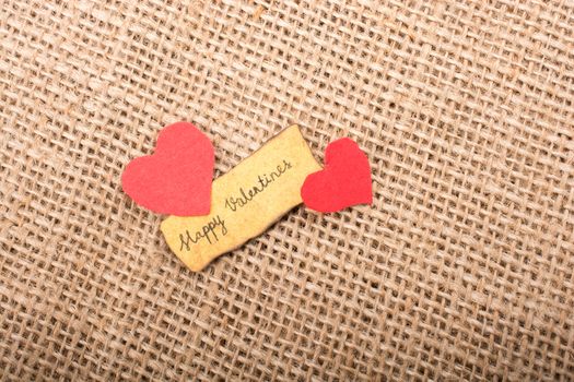 Love icon and Valentine's day wording on torn paper