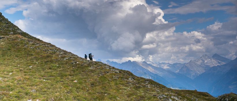 Extreme vacation in Alps hiking on mountain trek trail