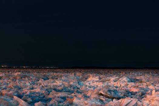 Evening view of the city of Khabarovsk in the winter. The ice on the Amur river.
