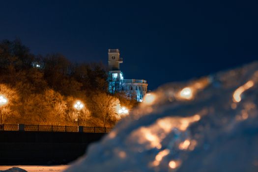 Evening view of the city of Khabarovsk in the winter. The ice on the Amur river.