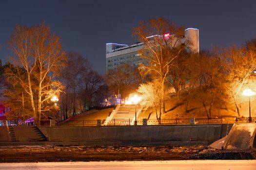Evening view of the city of Khabarovsk in the winter. The ice on the Amur river.