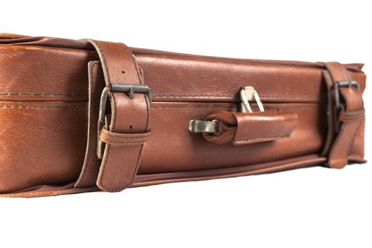 Old Brown leather used and weathered suitcase isolated on white background