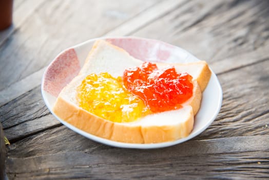 Slice of bread on a wooden table.