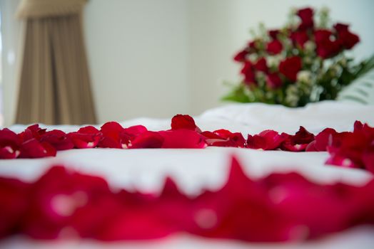 Roses placed on the the bed in wedding day. bridal house