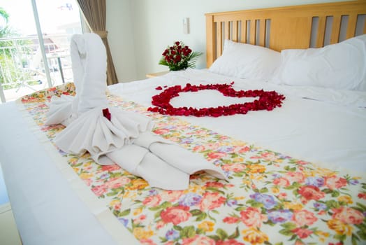 Roses placed on the the bed in wedding day. bridal house