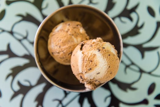 Chocolate chip ice cream on the table.