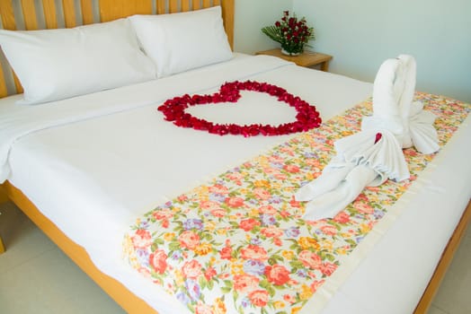 Roses placed on the the bed in wedding day. bridal house