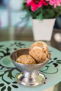 Chocolate chip ice cream on the table.