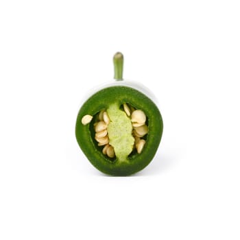 Close up one cut round slice of fresh green jalapeno hot chili pepper isolated on white background, low angle side view