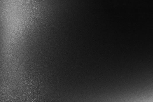 Texture of black hard steel in the dark background