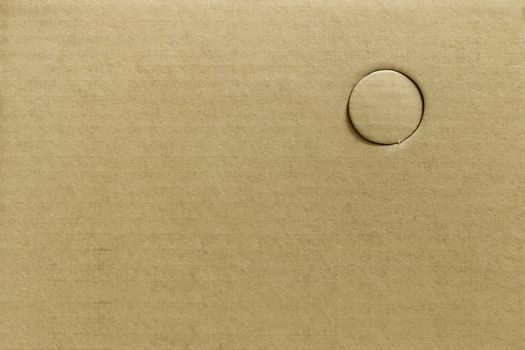 Texture of cutting hole brown paper or drilling holes on cardboard, abstract background