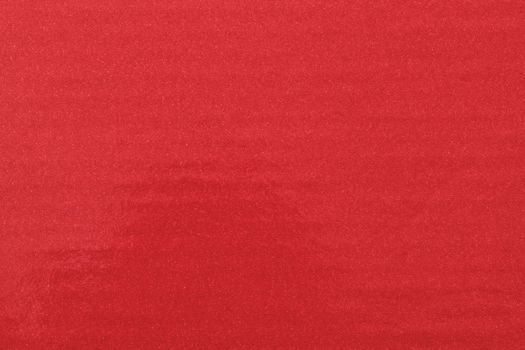 Texture of glitter red paint on plastic sheet, abstract pattern background