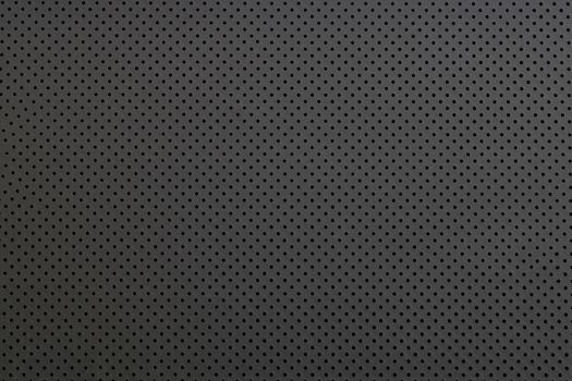 Texture of small black steel grating, abstract pattern background