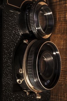 Old Camera Closeup on Brown Wood Baclground