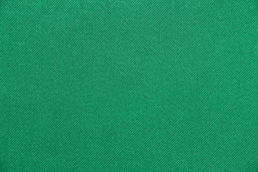 Texture of fabric green color has smooth surface, abstract background.
