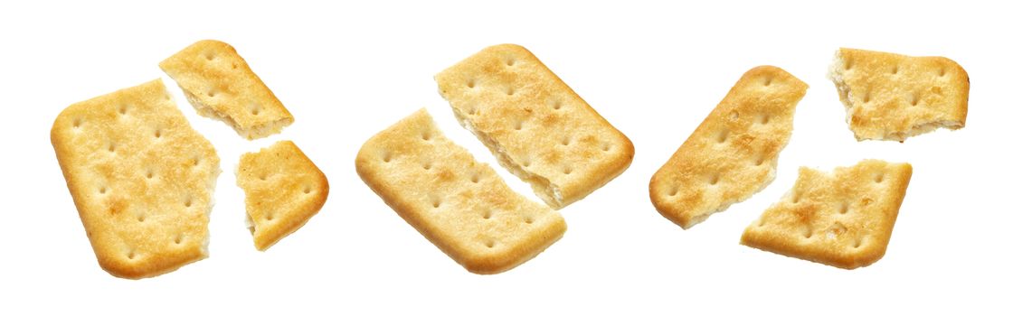 Broken cracker isolated on white background. Crushed dry cracker cookies isolated with clipping path