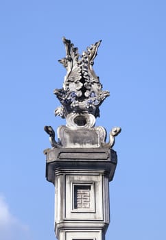 Decorative detail on a ornate column in a Vietnamese temple