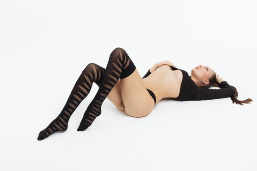 Perfect body young woman on a white background in sexy lingerie