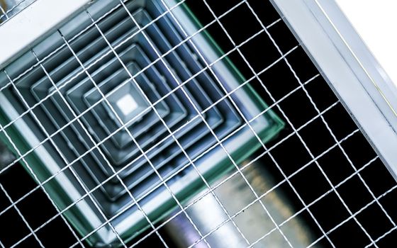 building interior air conditioner on the ceiling with wire mesh
