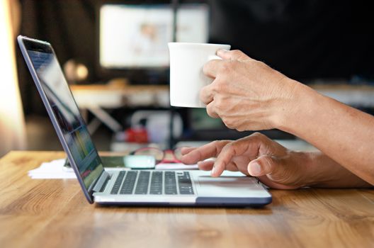 businessman using laptop computer  in office. hipster tone