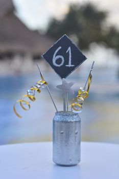 Blue card with the number sixtyone: placeholder to recognize the table at a restaurant