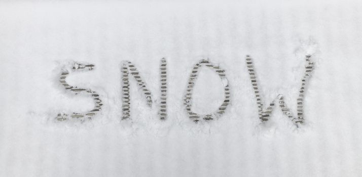 handwriting text letters snow in winter landscape in the white snow