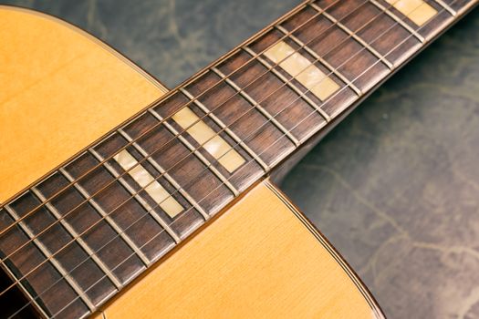 acoustic guitar on green marble background,music concept.