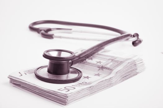 Euro banknote pile with black stethoscope inked black and white style image