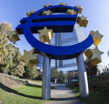 Euro symbol sign in frankfurt germany in mornin light with shadow