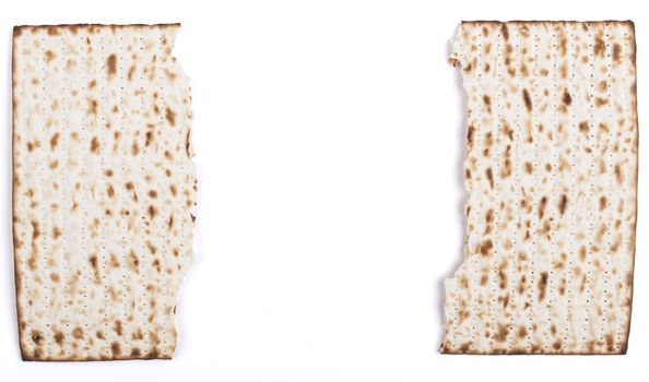 Broken in half Jewish traditional Pesach textured Matza bread substitute isolated on white background