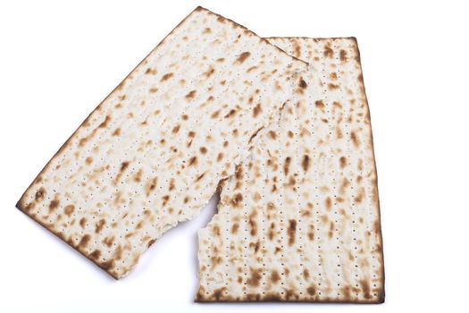 Broken  Jewish traditional Pesach textured Matza bread substitute isolated on white background