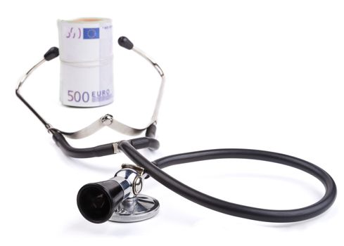 Black stethoscope  closeup with rolled euro  isolated on white background