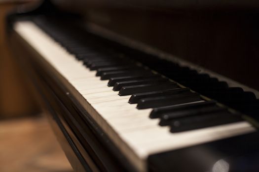 Old piano keys row close-up abstract shot