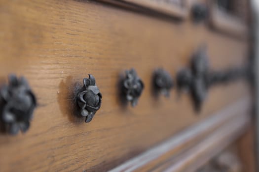 Black Metal fower ornaments on old wood door
