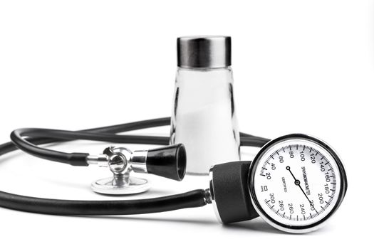 Salt an blood pressure tools isolated on white background