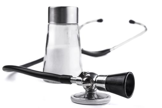Black stethoscope  closeup with salt  isolated on white background
