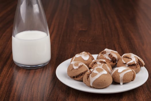 Milk and Cookies on brown wood table