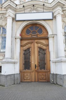 Olg wood gate with empty white sign above