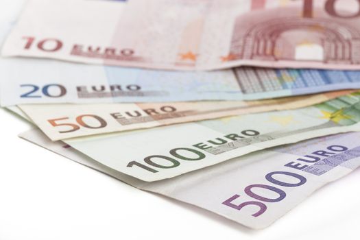 Different euro banknotes closeup on white background