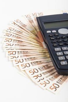 Fifty Euro banknotes with Black calculator isolated on white