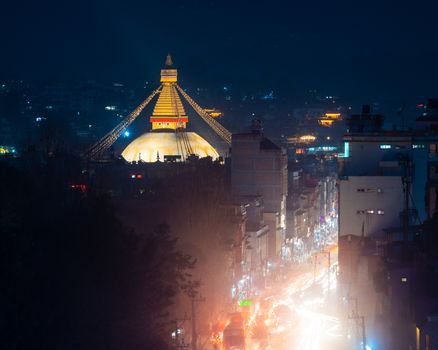 Boudhanath stupa and Boudha Road at night in Nepal. 