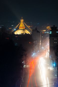 Boudhanath stupa and Boudha Road at night in Nepal. 