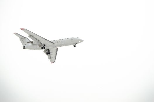 Aircraft with landing gear isolated on white background.