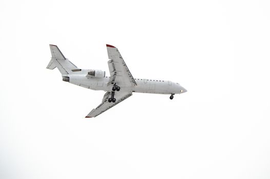 Aircraft with landing gear isolated on white background.