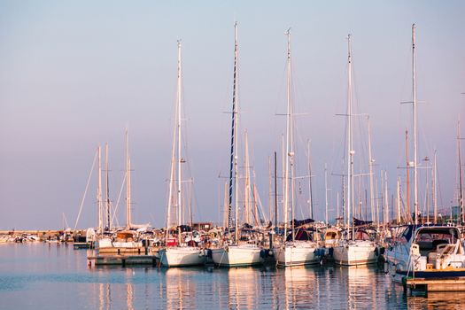 Marina with docked yachts at sunset in Giulianova, Italy