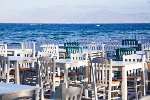 restaurant chairs and tables by the sea