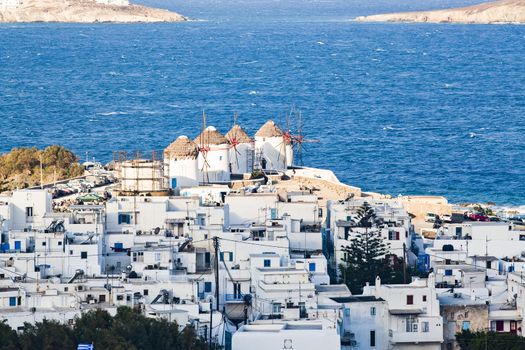 panoramic view of the Mykonos town harbor from the above hills on a sunny summer day, Mykonos, Cyclades, Greece